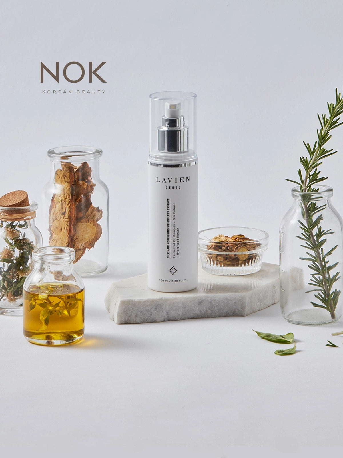 Elegant bottle of Silk Weightless Hair Essence – perfect for dry, damaged, or dull hair types